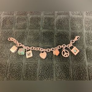 Tiffany & Co charm bracelet (7 charms). 100% authentic.